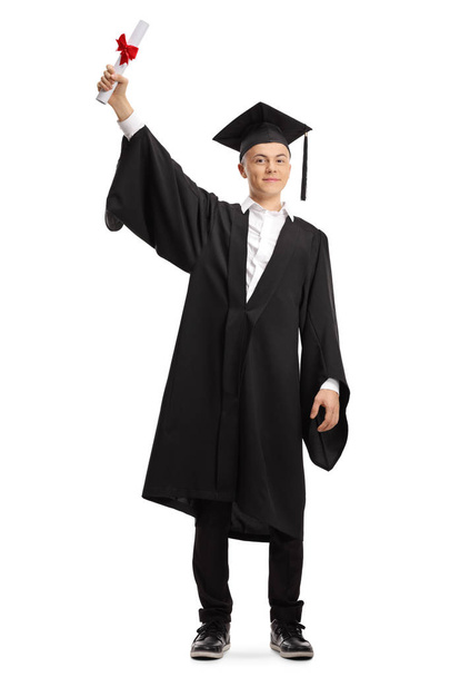 Happy young male graduate student holding a diploma - Fotó, kép
