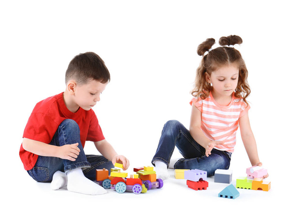 Cute little children playing with toys on white background - Photo, image