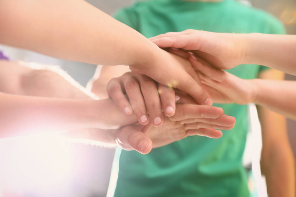 Group of volunteers joining hands together, closeup - Photo, Image
