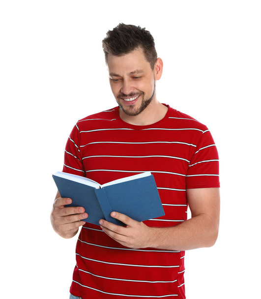 Handsome man reading book on white background - Zdjęcie, obraz