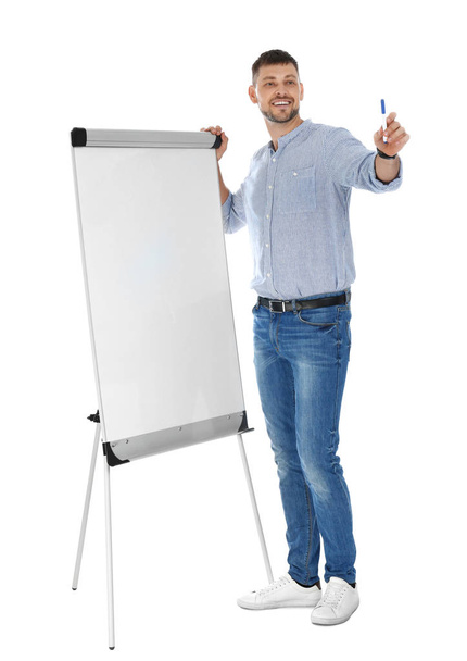 Professional business trainer near flip chart board on white background. Space for text - Фото, изображение