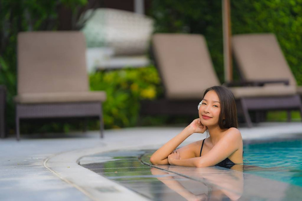 Portrait young asian woman relax smile happy around outdoor swim - Foto, immagini