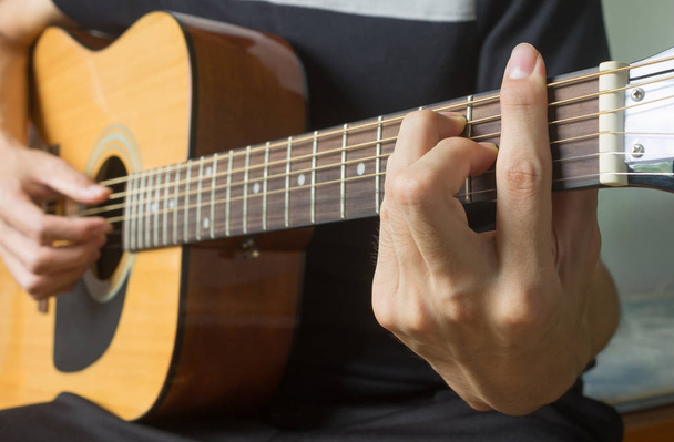 Guitar Player Hand in F Major Chord on Acoustic Guitar in Side V - Fotografie, Obrázek