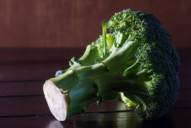 Fresh broccoli on wooden table. Close up - Photo, Image