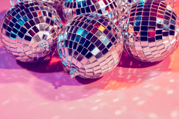 disco ball bauble on pink background.  party concept - Zdjęcie, obraz