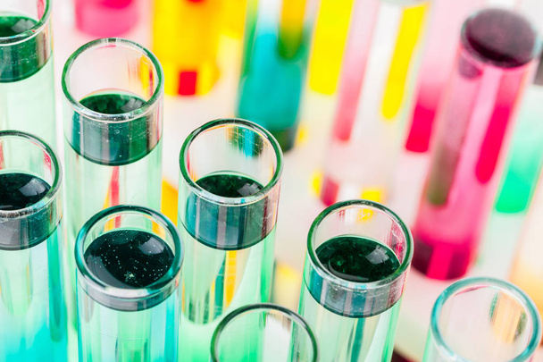 Still life in laboratory. Test tubes with colorful chemicals - Foto, Bild