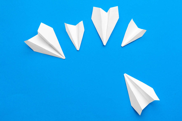 white paper airplane on a navy paper background - 写真・画像