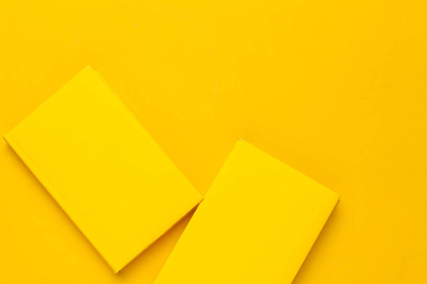Books on a yellow background - Foto, Imagen