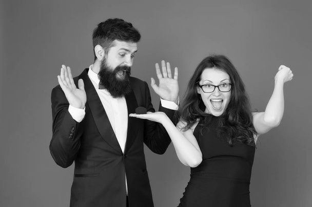 happy day. woman make bearded man marriage proposal. love date and romance. valentines day. sexy couple in love. tuxedo man and elegant lady at engagement party. happy formal couple. ring in box - 写真・画像