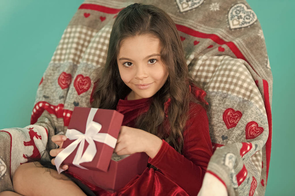 From Santa. Cute little child girl with new year present. Happy little smiling girl open new year gift box. Festive celebration of the New Year Eve at home. Merry Christmas and Happy New Year - Фото, изображение