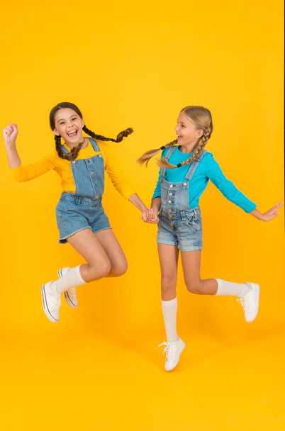 Patriotic upbringing. We are ukrainians. Ukrainian kids. Children ukrainian young generation. Patriotism concept. Girls with blue and yellow clothes. Freedom value. Living happy life in free country - Foto, Bild