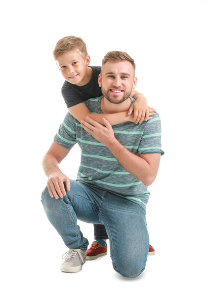 Portrait of happy father and son on white background - Foto, imagen