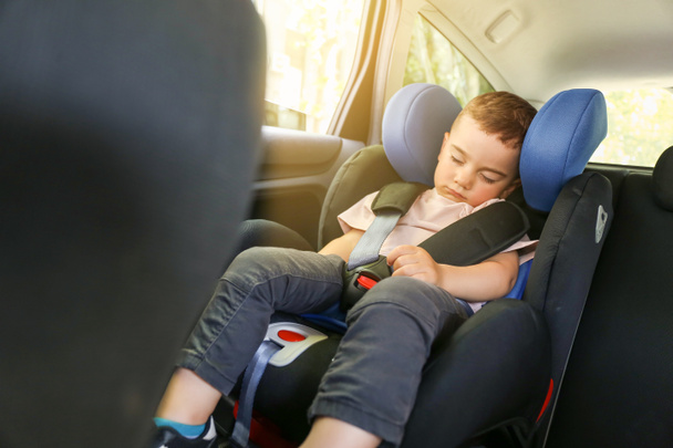 Sleeping baby boy buckled in car seat - Photo, Image