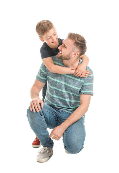 Portrait of happy father and son on white background - Photo, Image