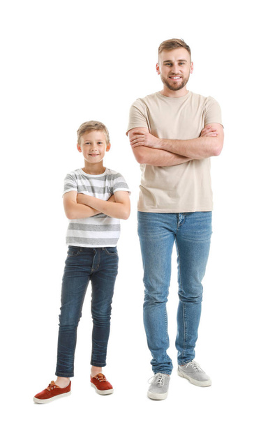 Portrait of happy father and son on white background - Φωτογραφία, εικόνα