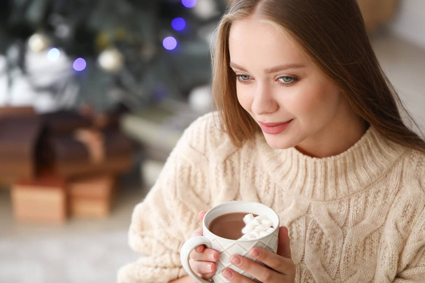 Beautiful woman drinking hot chocolate at home - Foto, Imagen