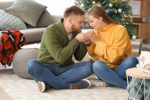 Young couple drinking hot chocolate at home - Photo, Image