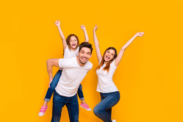 Portrait of three nice attractive charming cute lovely stylish cheerful cheery childish playful glad ecstatic person having fun dancing isolated over bright vivid shine yellow background - Фото, зображення