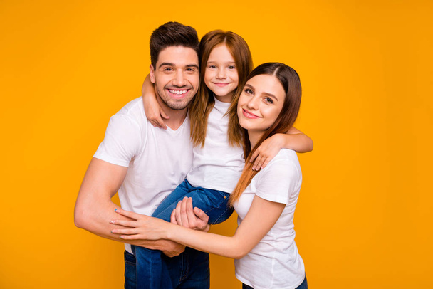 Portrait of three nice attractive charming cute sweet tender kind lovely cheerful cheery glad person embracing having fun day life dream isolated over bright vivid shine yellow background - Valokuva, kuva