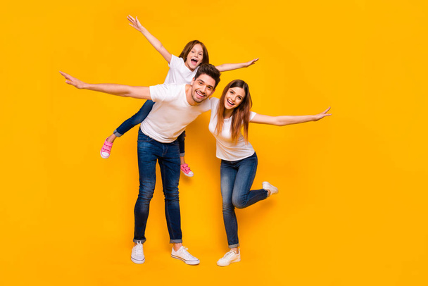 Full length body size view of three nice attractive adorable charming lovely stylish cheerful cheery carefree person having fun weekend isolated over bright vivid shine yellow background - Photo, Image