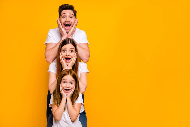 Portrait of three nice attractive charming lovely cute careful cheerful cheery stunned person in order of hierarchy unexpected great news isolated over bright vivid shine yellow background - Foto, imagen