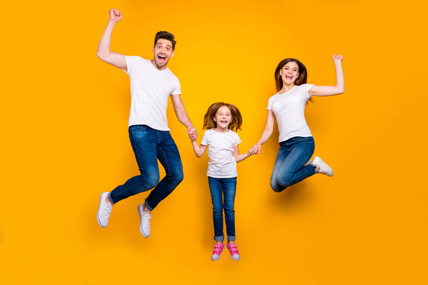 Full length body size view of three nice attractive adorable slim fit sporty lovely stylish cheerful cheery carefree person having fun rejoicing isolated over bright vivid shine yellow background - Photo, image