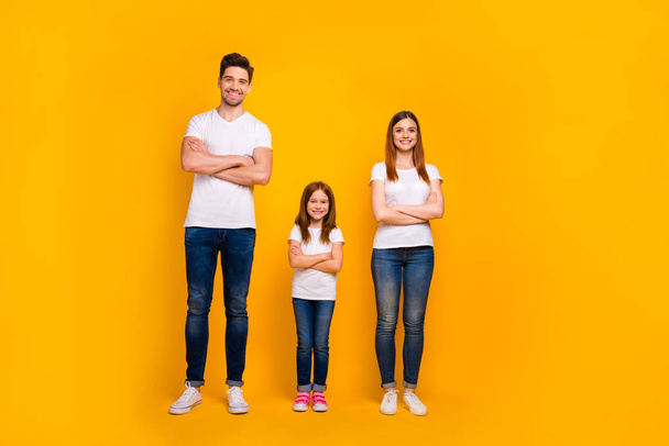 Full length body size view of three nice attractive charming lovely stylish trendy cheerful cheery content person folded arms isolated over bright vivid shine yellow background - Fotografie, Obrázek