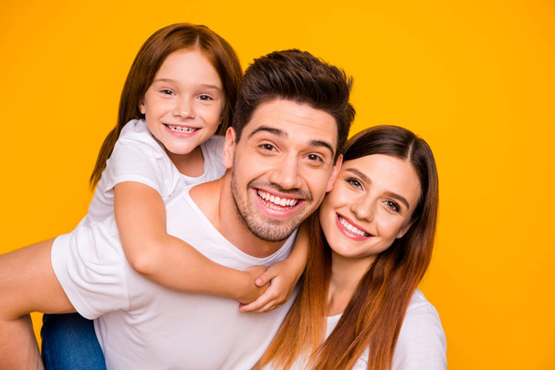 Close-up portrait of three nice attractive lovely cheerful cheery tender sweet person having fun spending weekend holiday daydream isolated over bright vivid shine yellow background - Foto, imagen