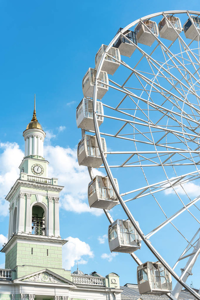 Observation wheel on a sunny summer day, Kontraktova Square, Kiev, Ukraine, Jul. 2019 - Photo, Image