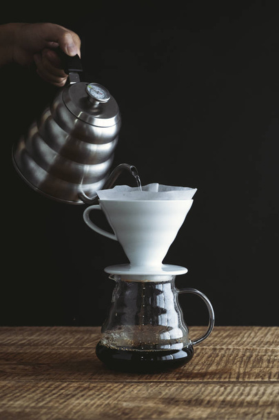black coffee drip On the wood Dark tone - Valokuva, kuva