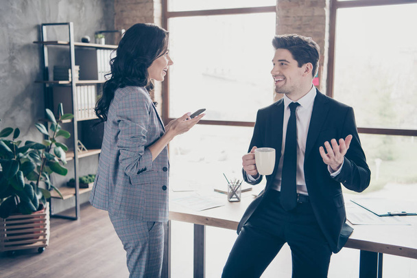 Photo of two business people having coffee break standing workstation communicating dressed formal wear suits - Photo, Image