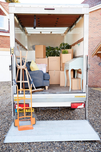 Removal Truck Waiting Outside of New Home On Moving Day - 写真・画像