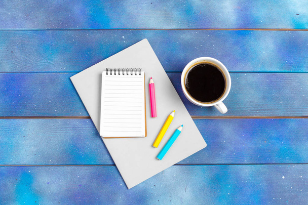 Mockup for check list, empty note paper with coffee cup on blue wood background. Office, writer or study concept - Photo, image