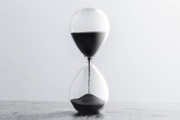 Close up hourglass on table - Zdjęcie, obraz