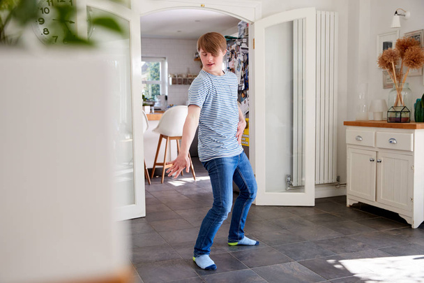 Young Downs Syndrome Man Having Fun Dancing At Home - Fotoğraf, Görsel