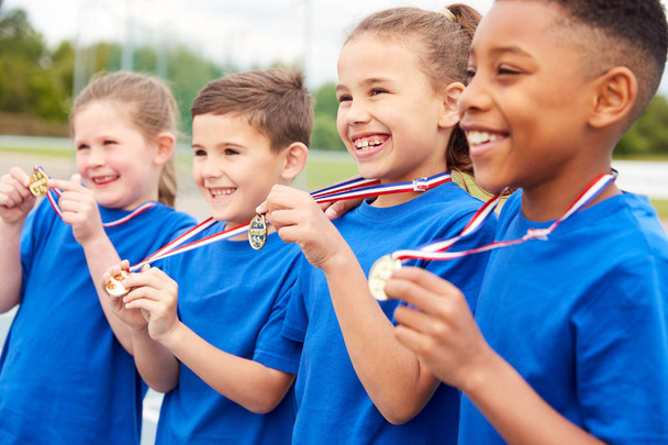 Children Showing Off Winners Medals On Sports Day - Fotoğraf, Görsel