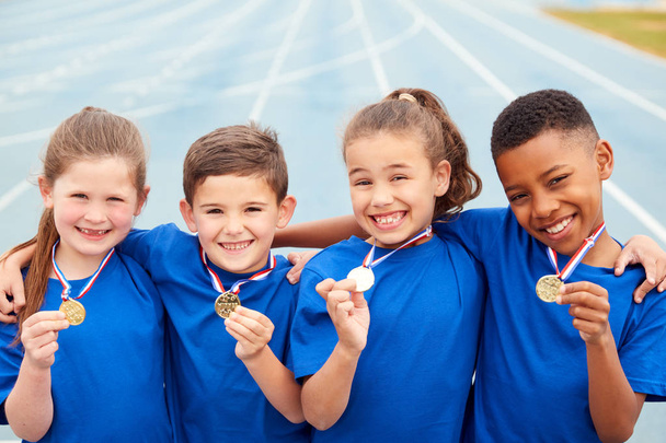 Portrait Of Children Showing Off Winners Medals On Sports Day - Zdjęcie, obraz