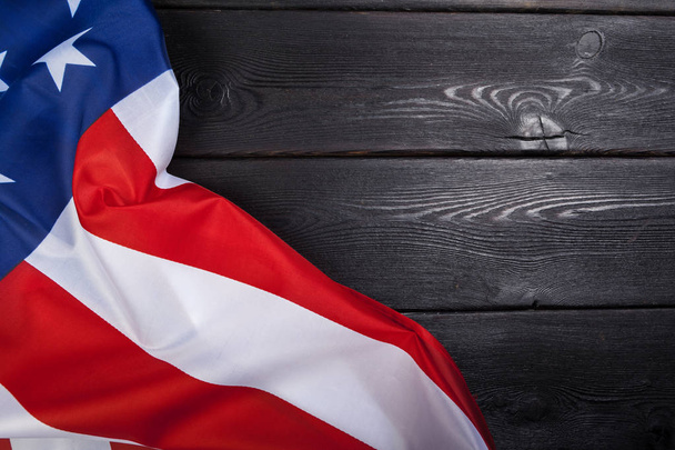 USA flag on dark wooden table background - Φωτογραφία, εικόνα