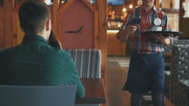 Girl and man are talking in city cafe - Footage, Video