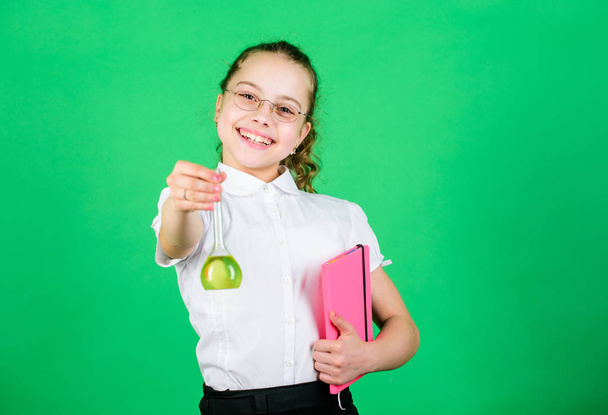 New ideas for medicine. small smart girl with testing flask. back to school. child study bilogy lesson with note. education and knowledge. science research in lab. Small school girl - Φωτογραφία, εικόνα