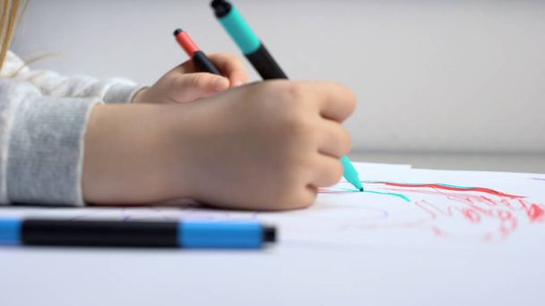 Child drawing with colored pencils, art therapy for children, rehabilitation - 写真・画像