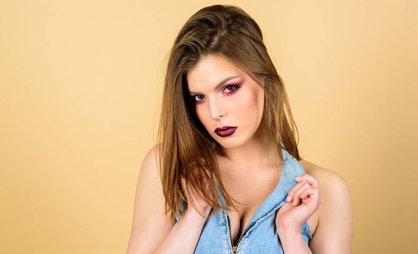 Perfect makeup. Confident in her impeccable appearance. Makeup cosmetics concept. Feminine and glamorous. Attractive woman makeup face. Sensual fashion model sexy decollete. Dark lips and smoky eyes - Fotoğraf, Görsel