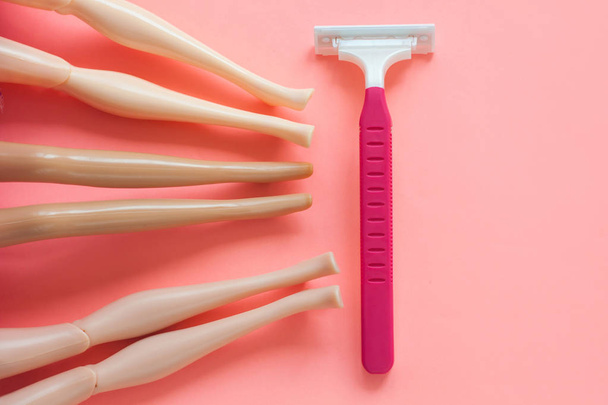 Disposable shaving machine for women on a pink pastel background, flatley, copy space. - Photo, Image