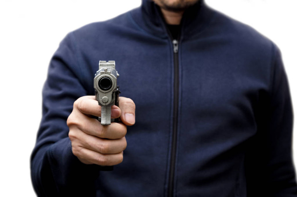 Hombre llevando un arma de juguete para robar el dinero en blanco aislado
 - Foto, Imagen