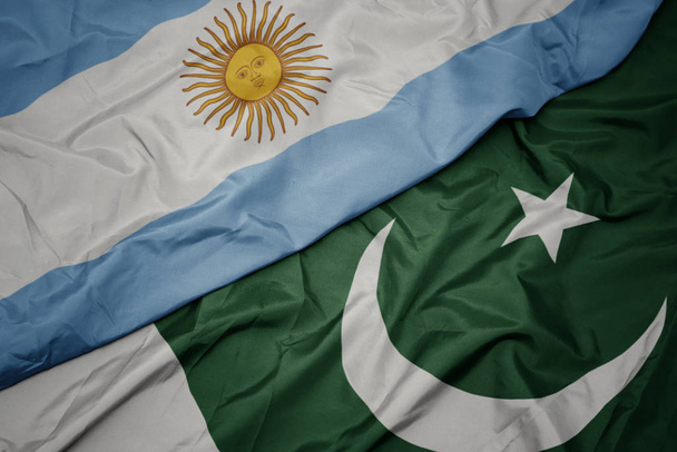 розмахуючи барвистий Прапор Пакистану і Національний прапор Аргентини. - Фото, зображення