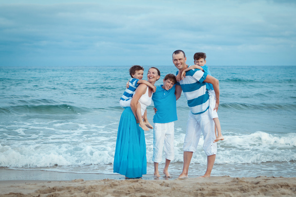 Young family with three kids on vacation - Foto, imagen