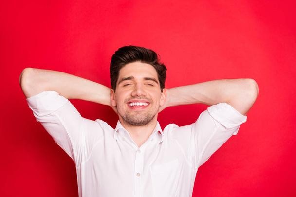 Close-up portrait of his he nice attractive lovely cheerful cheery positive peaceful guy enjoying free time weekend closed eyes isolated over bright vivid shine red background - Foto, immagini