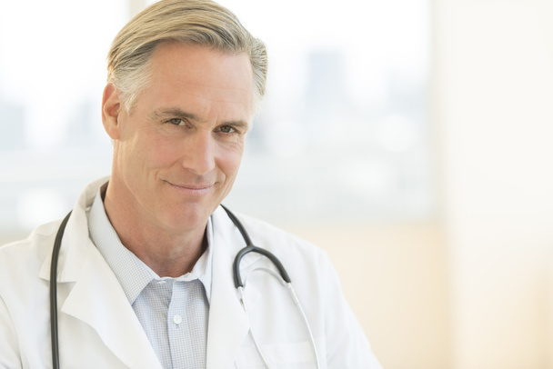 Male Doctor With Stethoscope Around Neck In Clinic - Zdjęcie, obraz