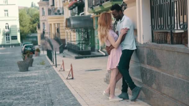 Young couple in love standing and tenderly cuddling on streets of European cities - Metraje, vídeo