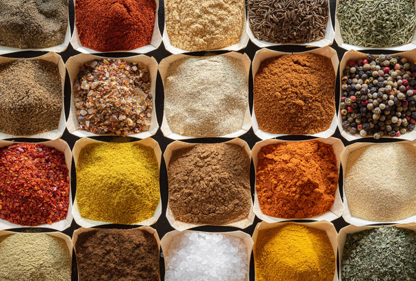 Herbs and spices in bowls background. Cooking flavors - Photo, Image